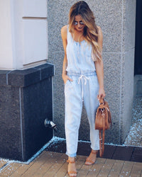 Women's fashionable, form-fitting, casual, cinched-waist vest and denim jumpsuit